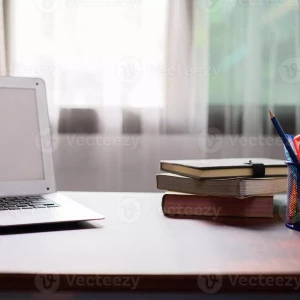 notebook-computer-books-at-the-desk-photo